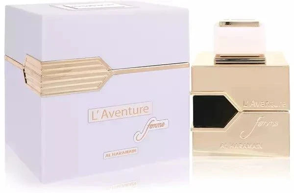 L'Aventure Femme perfume bottle by Al Haramain surrounded by wild berries and flowers representing fruity, floral, and warm scent notes.