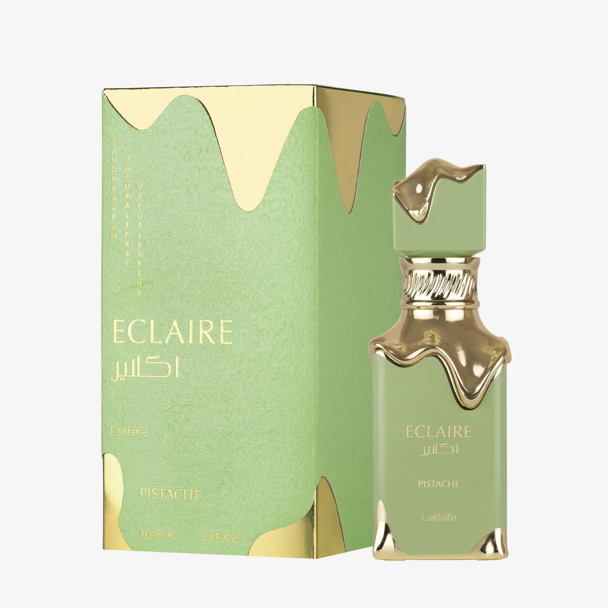 Lattafa Eclaire Pistache perfume in a pale green glass bottle with ornate gold trim and matching green box.