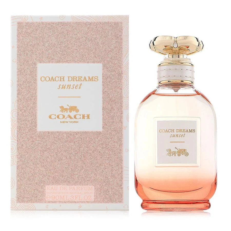 Coach Dreams Sunset women's floral gourmand perfume bottle with pear, jasmine, and tonka bean notes against a sunset background