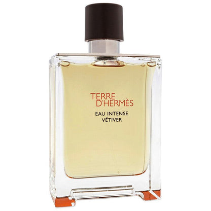 Hermès Terre d’Hermès Eau Intense Vétiver perfume in a clear glass bottle with pale amber liquid and dark cap.