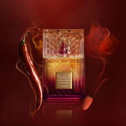 Lattafa Khamrah Dukhan eau de parfum bottle with gradient amber to deep purple glass and textured clear cap with spicy chili and burning match accents