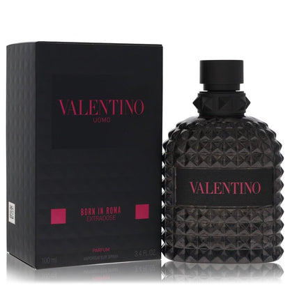 Men’s parfum spray bottle with black faceted glass, matching box and magenta lettering, Valentino Uomo Born in Roma Extradose.
